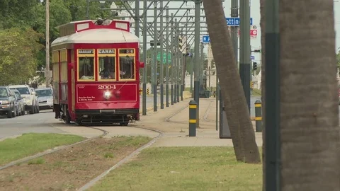 Man getting into tram at the tram stop Stock Footage 84634420