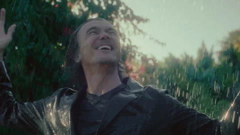 Man getting wet in the rain Stock Footage 279065970