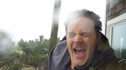 Man Getting Wet in Windy Rain Storm Stock Footage 5459202