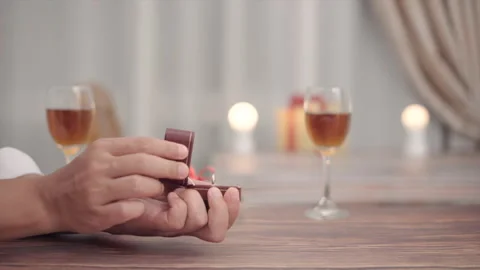 Man gift  the ring to his girlfriend to engage in valentines day. Stock Footage 147274553