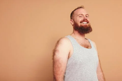 Man with a ginger beard smiling at the camera 스톡 사진