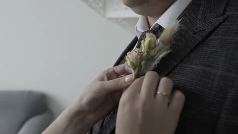 A man is given a wedding boutonniere Video stock 306148250