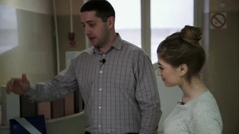 Man gives explanations for each type of building materials Stock Footage 82140564