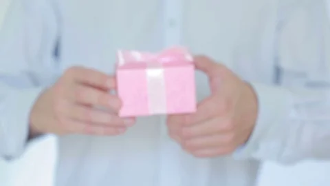 Man gives a gift in the box Stock Footage