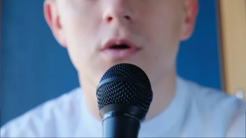 A man gives an interview or comments on a situation into a microphone Stock-Footage 144488156