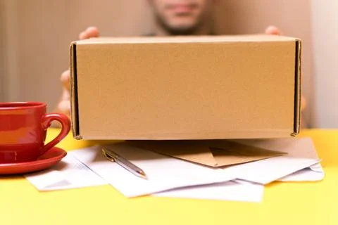 The man gives a package 스톡 사진