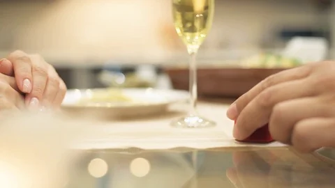 Man gives red box with engagement ring, making marriage proposal to girlfriend. Stock Footage 77828441