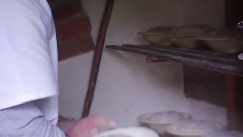 Man Gives Shape to a Dough With Help of Plate Stock Footage 74511418