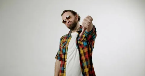 Man Gives Thumbs Down Gesture of Disapproval Stock Footage 312455332