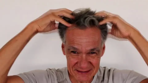Man giving himself a Head Massaging Stock Footage 169254143