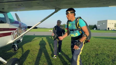 Man giving instructions how to jump off a plane Stock Footage 55340289