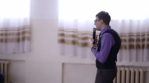 Man giving a lecture to an audience Stock Footage 62801763