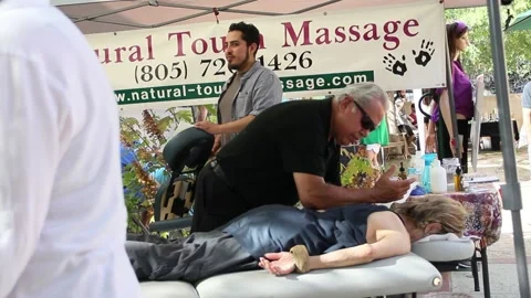 Man giving massage at CBD fair Stock Footage 150801732