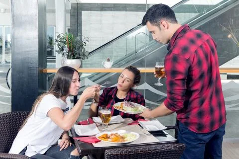 Man giving plate with beer snacks Stock Photos