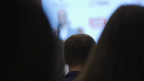 Man is giving a presentation in front of a group of people Stock Footage 299973818