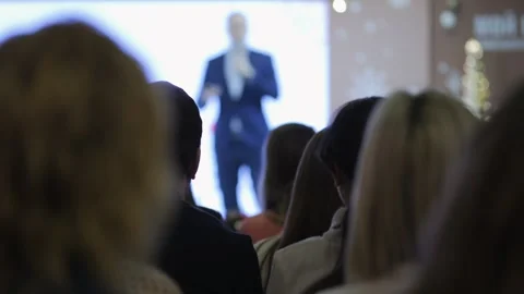 Man is giving a presentation to a group of people Stock Footage 301941034