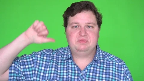 Man Giving Thumbs Down Sign signifying rejection, refusal, or disapproval on Stock Footage 83601018