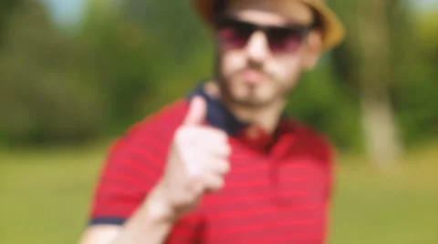 Man Giving Thumbs Up Success Hand Sign Happy With Beard Outside Video stock 59478056