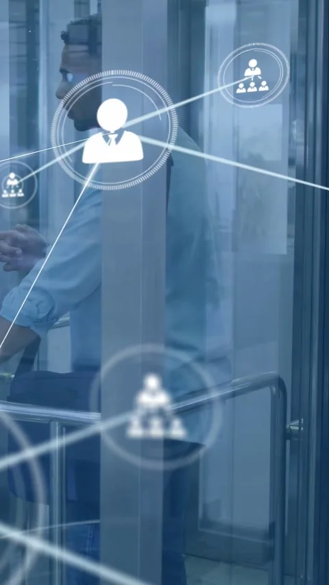 Man in glass pod watching network nodes appearing, causing leaning, gesturing, Stock Footage 332984989