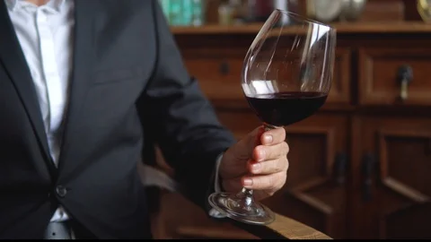Man with a glass of red wine Stock-Footage 116335359