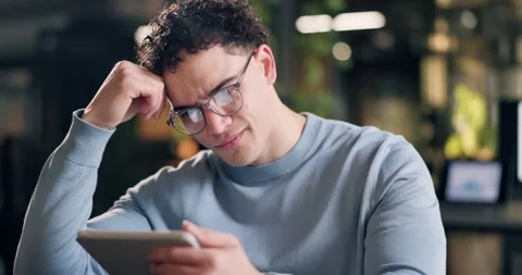 Man, glasses and doubt with tablet in office for reading engagement charts, bad Stock Footage 342781218