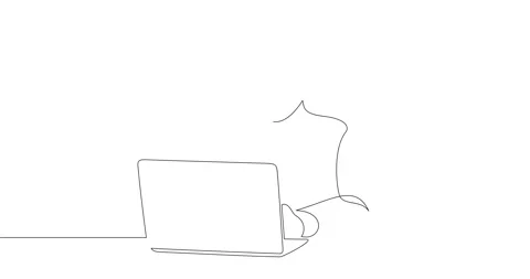 A man in glasses and a headset is sitting behind a laptop. Stock Footage 247334635