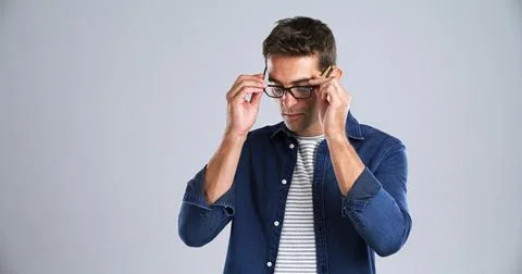 Man, glasses and optometry in studio for testing, vision or adjusting to new Stock Photos