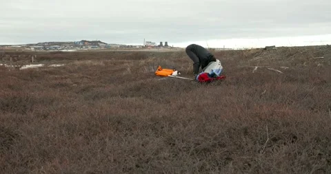 Man in glasses assembles kayak putting reinforcing elements Stock Footage 197059991