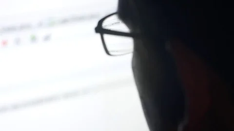 Man with glasses browsing internet Stock Footage 81146069