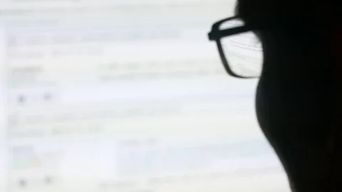 Man with glasses browsing internet Stock Footage 81146074