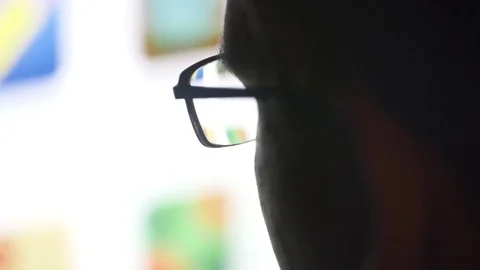 Man with glasses browsing internet Stock Footage 81146081