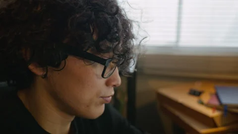 Man with Glasses Coding on Laptop with Multiple Monitors Stock Footage 338423315