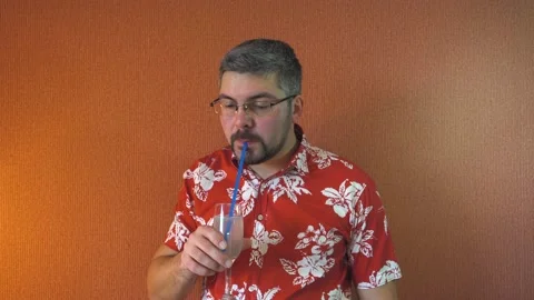 Man with glasses drinking juice 4K Video stock 196168476