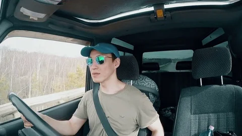 Man with Glasses Driving Car Stock Footage 76848576
