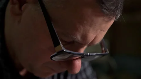 Man with glasses at the factory checks technical documentation of the project Stock Footage 149306382