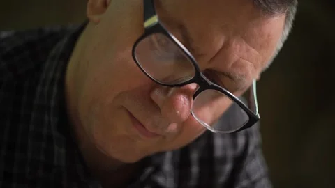 Man with glasses at the factory checks technical documentation of the project Stock Footage 149313659