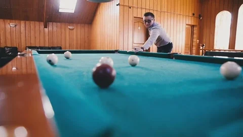 Man with glasses hitting the ball Stock Footage 81543443