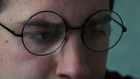 Man with glasses indignantly works at the computer Stock Footage 167133787