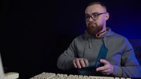 Man With Glasses Inserting DVD Into Old Desktop Computer From 1990's Stock Footage 301276918