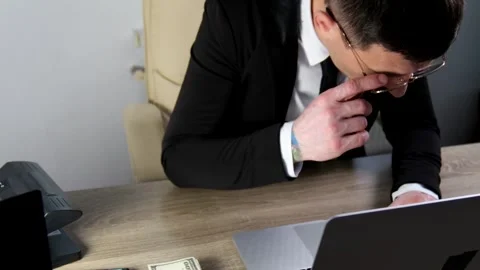 Man in glasses, jacket and tie, businessman or banker typing on laptop, working Stock Footage 324513580