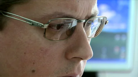 Man with glasses looking at the computer screen Stock Footage 43281838