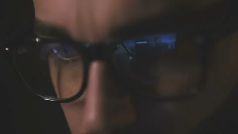 Man in glasses looking at the computer screen Stock Footage 106779635