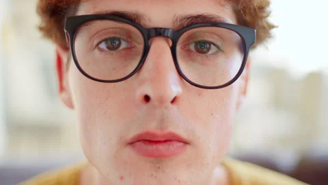 Man in glasses looking confidently at camera Stock Footage 155528479