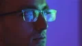The man in glasses looking to the display 4k or 4k+ Resolution