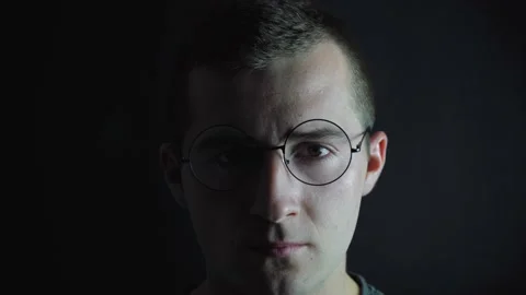 Man with glasses looks at the camera Stock Footage 140650245
