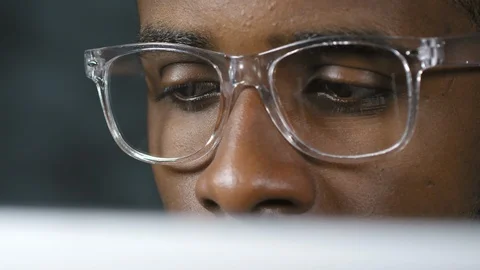 Man in Glasses Reading from Computer Screen Stock Footage 103526728