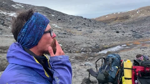 Man with glasses smokes a cigarette Stock-Footage 140085816