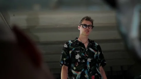 Man in glasses speaks with a man close-up Stock Footage