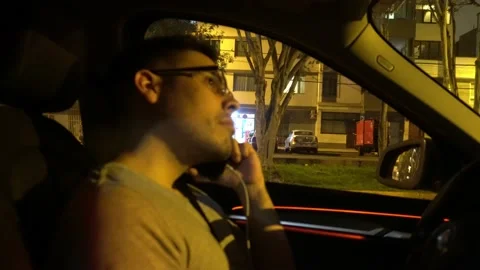 A man with glasses talking on a connected cell phone and carrying his mother Видео 155869534