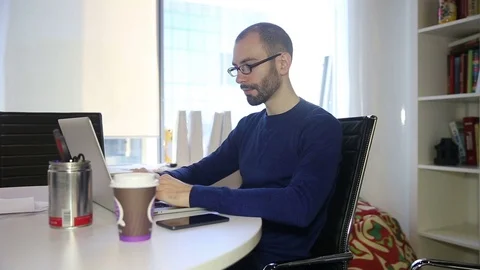The man in glasses uses phone Stock Footage 69986631